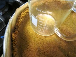 sweet potato cheesecake: Pressing in the crust