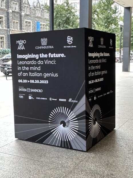 Exterior of the Martin Luther King Jr. Memorial Library showing a cube with posters for the da Vinci exhibit.